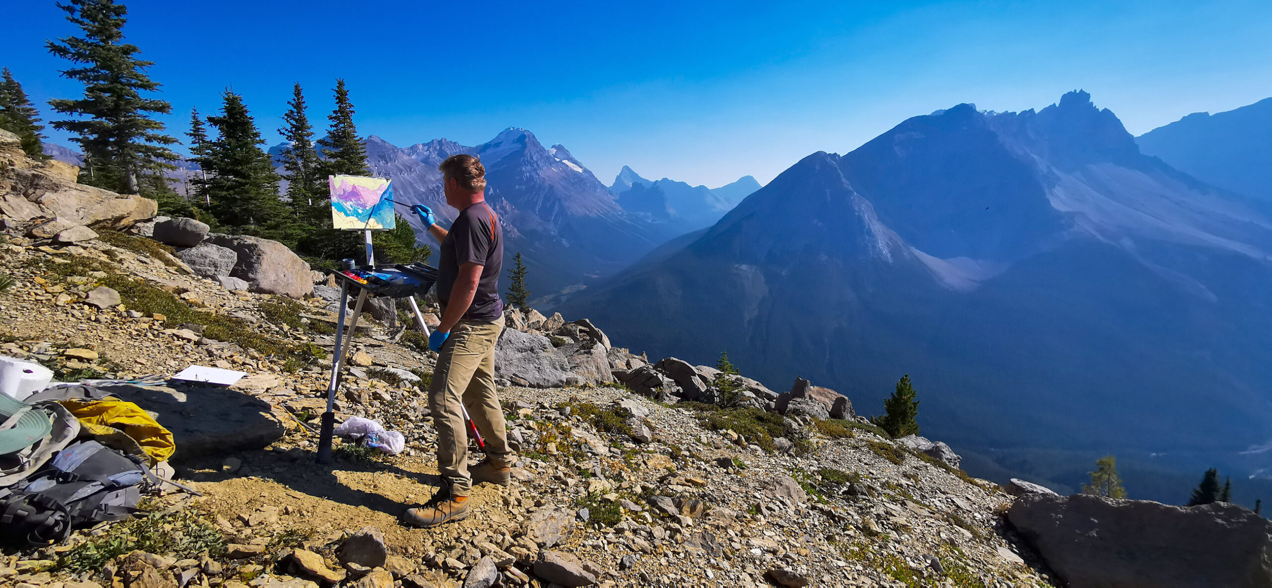 Dominik Modlinski painting on the mountain top