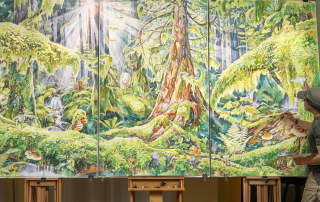 artist painting a forest on a mural
