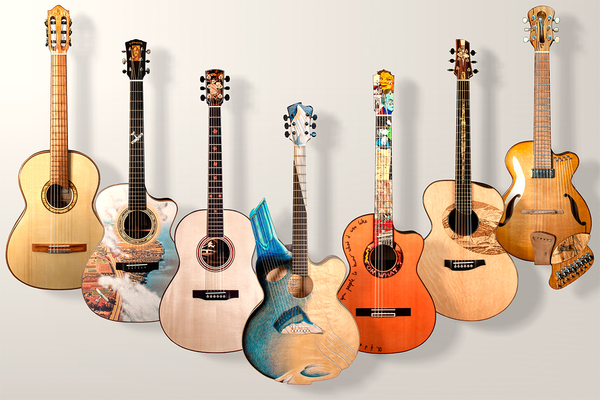 seven guitars side by side in a vertical position