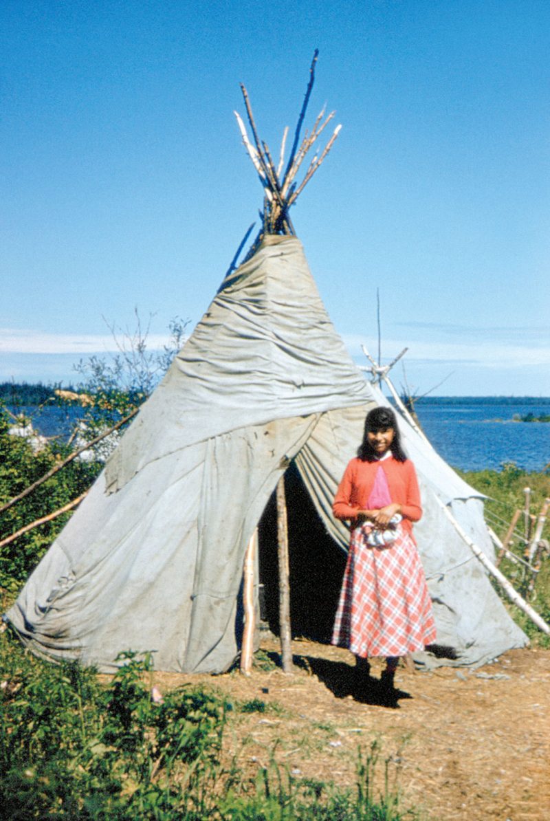 Webequoi girl standing in front of a teepee at Lansdowne-House
